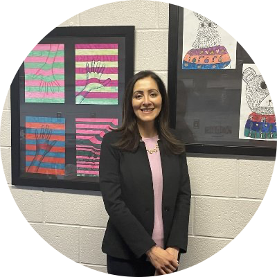 Principal Odera in a black suit