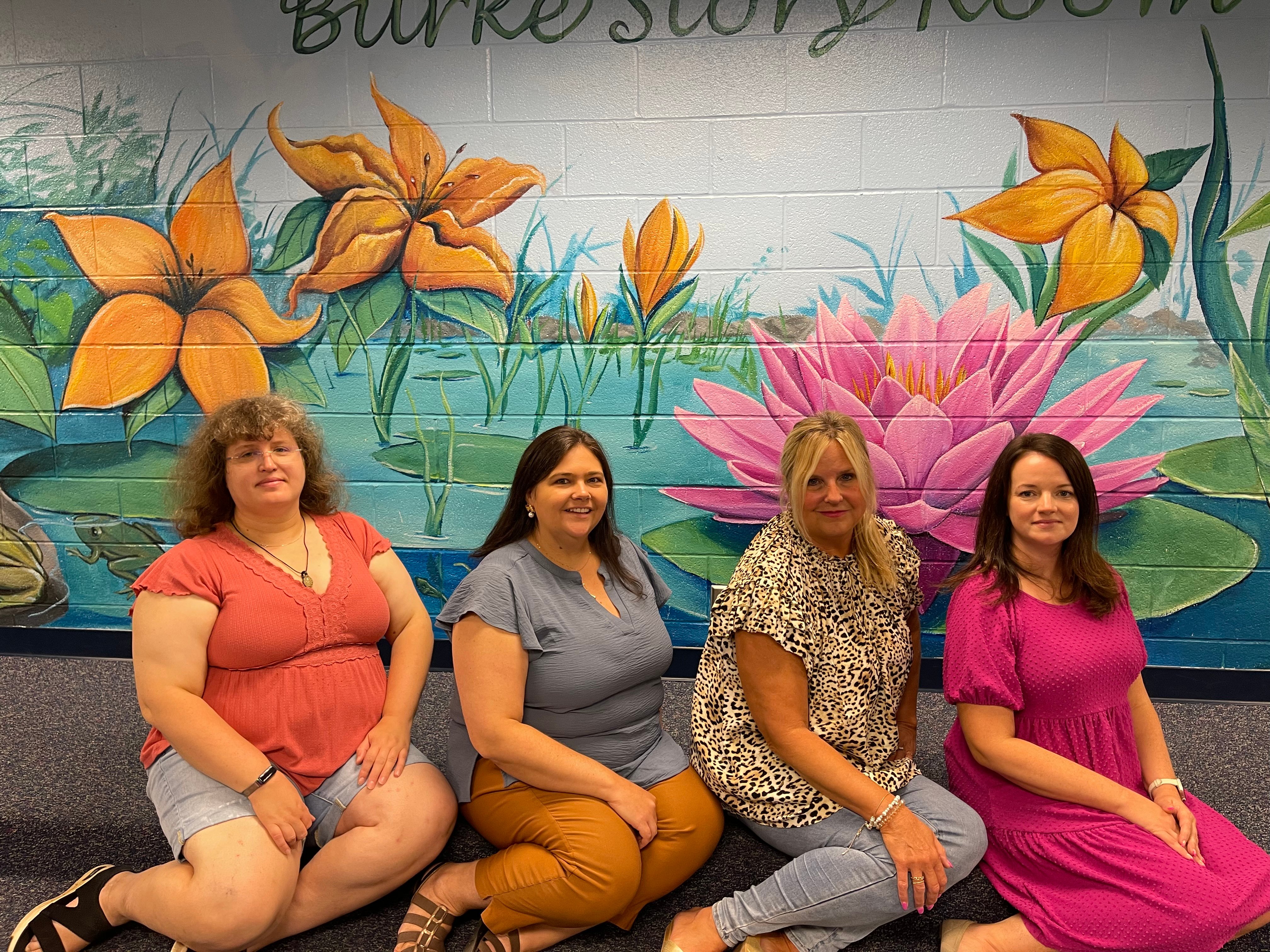 First Grade teachers sitting in the storybook room